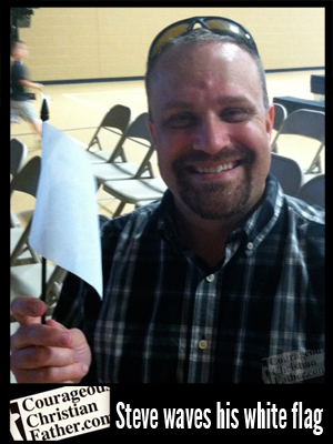 Steve waves his white flag at the 2013 Unity Festival.