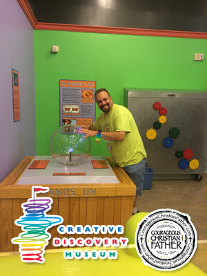 Steve touching the Static Ball at Creative Discovery Museum